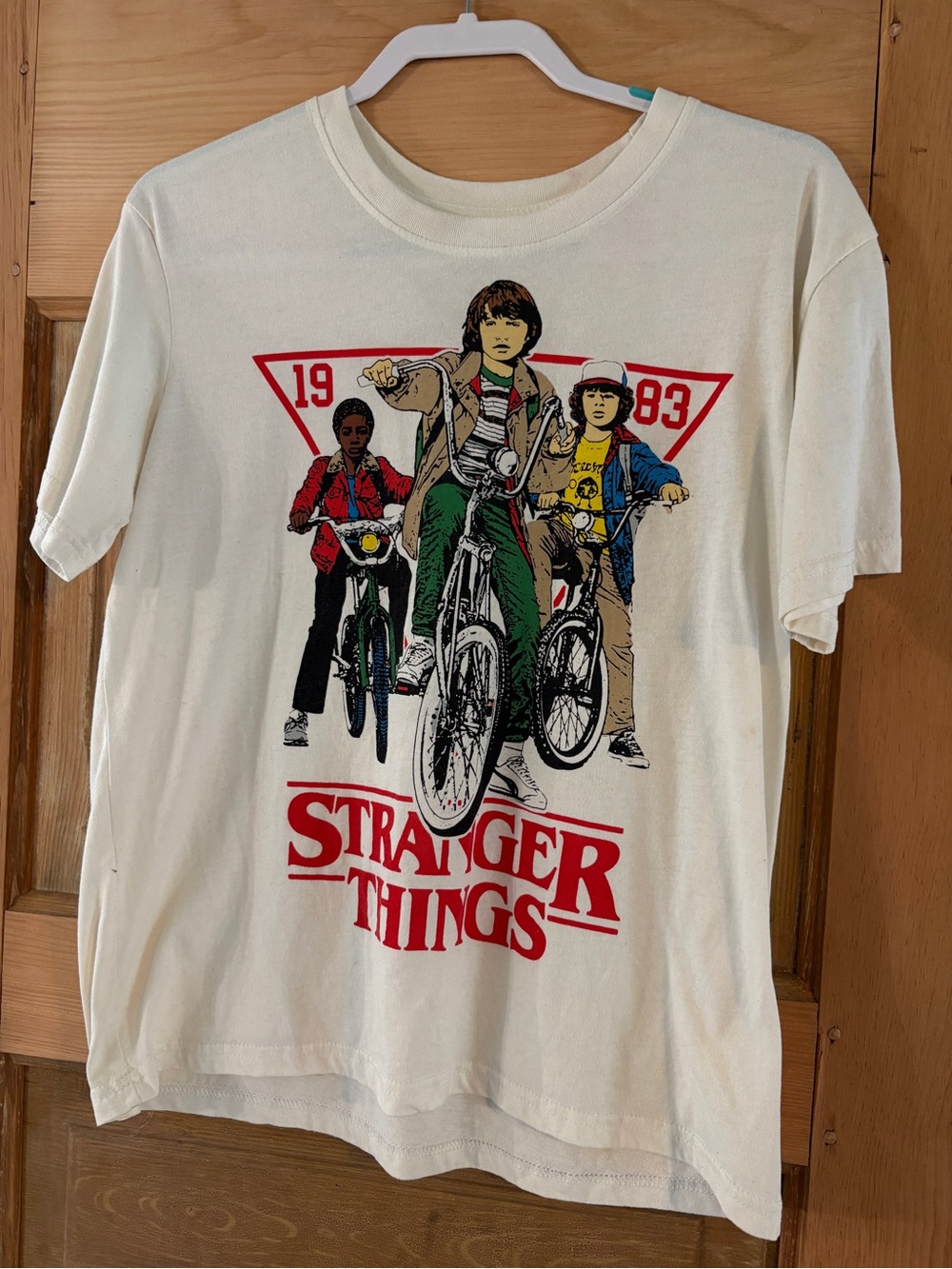 Netflix Cream Stranger Things Graphic Tee with Red Logo